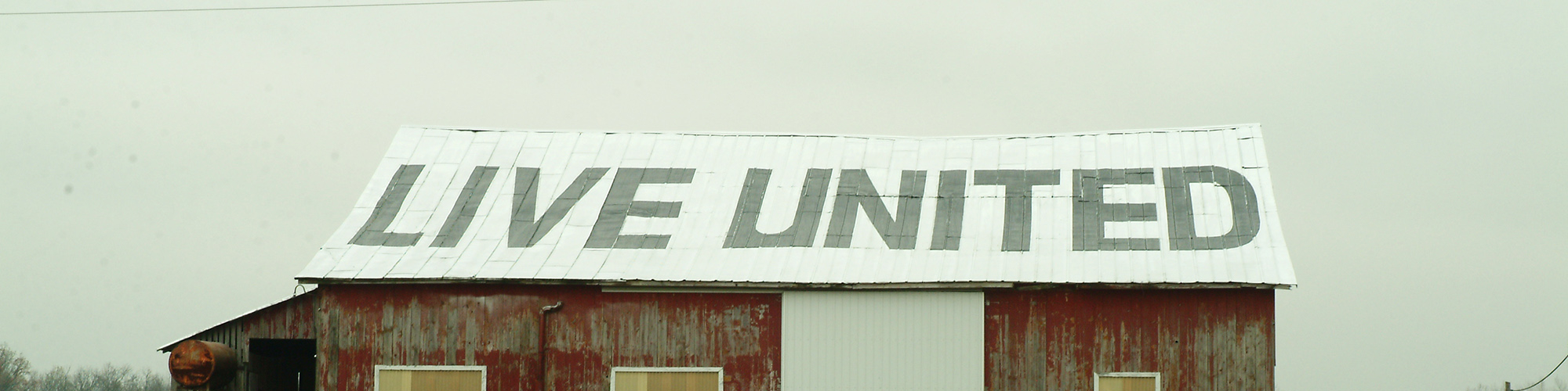 Live United written on the roof of a barn