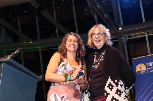 Annie Stockton (left), vice president of the Gemma E. Moran United Way/Labor Food Center, presents the Gemma E. Moran Inspiration Award to State Senator Cathy Osten.