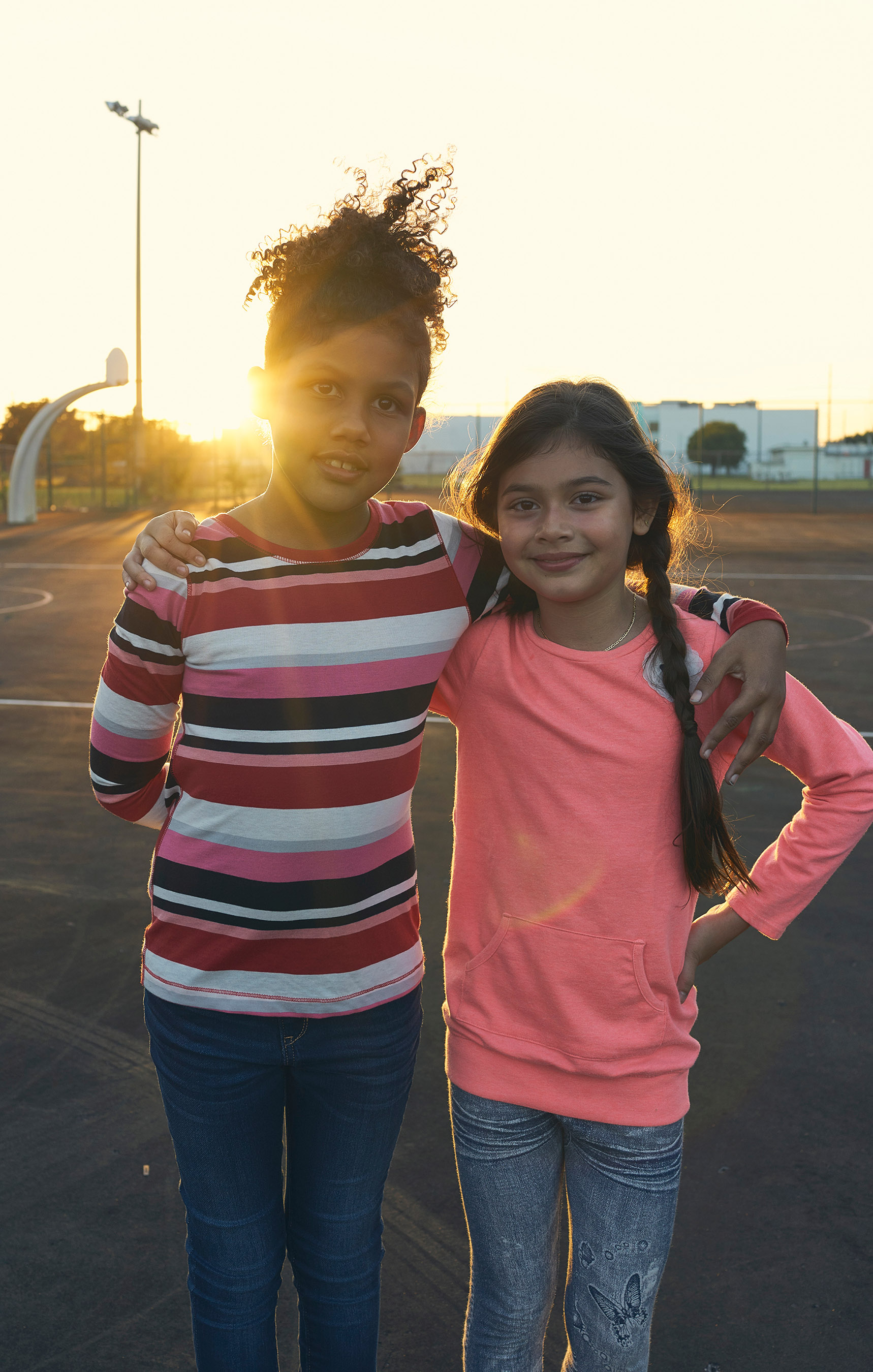 Two girls with arms around each other