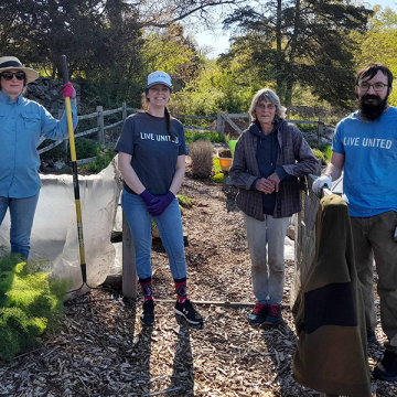 Volunteers working at a local giving garden