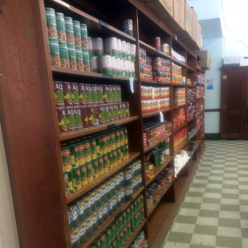 Shelves filled with nonperishable food items at a Food Center member agency