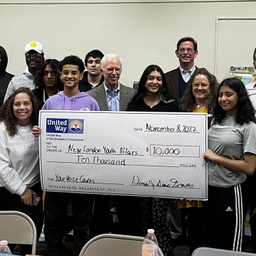 Students from New London Youth Affairs with check presentation to the group