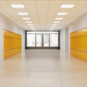 School hallway with lockers and a doorway showing in the middle