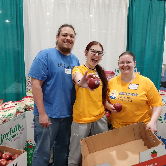 Volunteers collecting produce at a food show