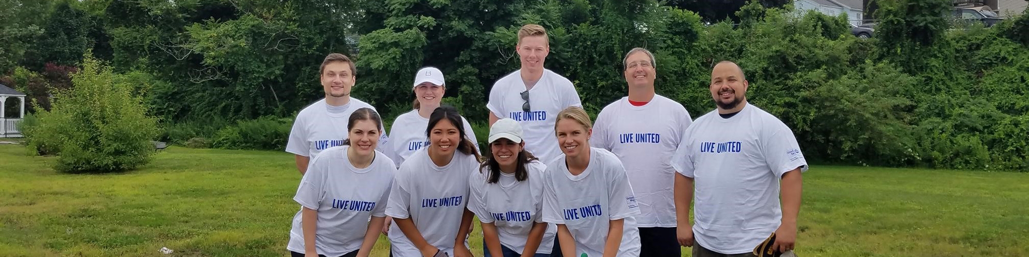 Volunteers doing lanscaping at at United Way Day of Caring project